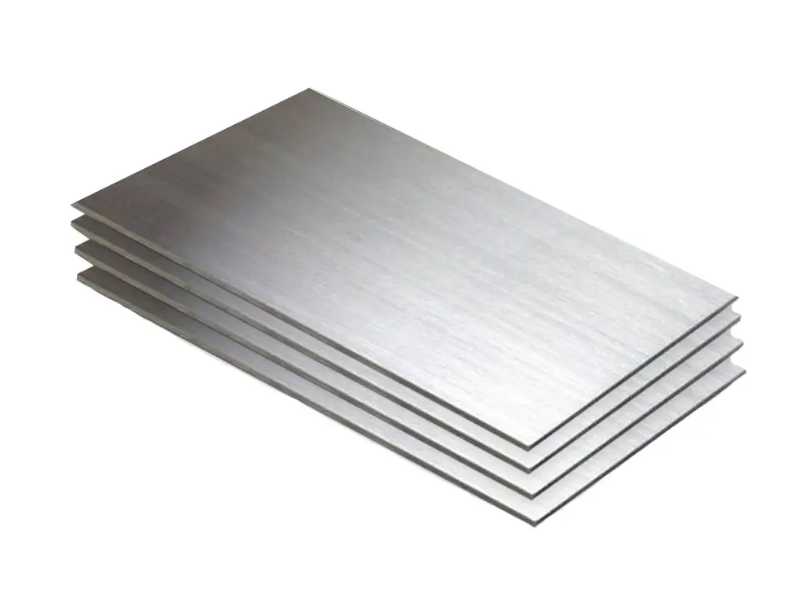 Stack of four brushed metal sheets in a neat pile, angled view