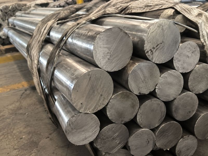 Bundle of solid round 316L stainless steel bar stock ready for CNC machining into shackle bodies