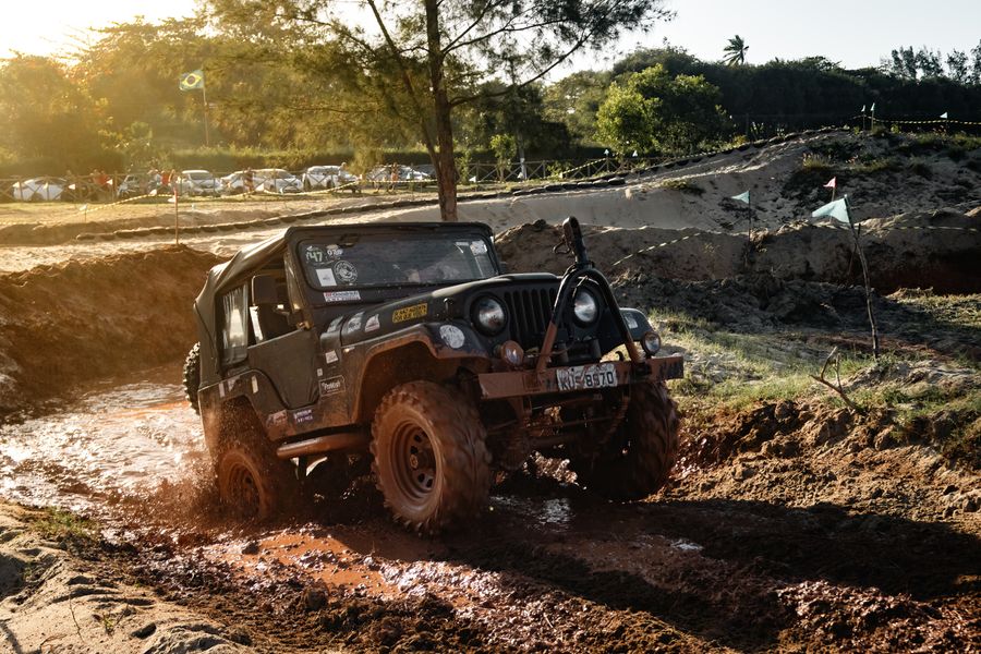 Off-road 4x4 driving through mud