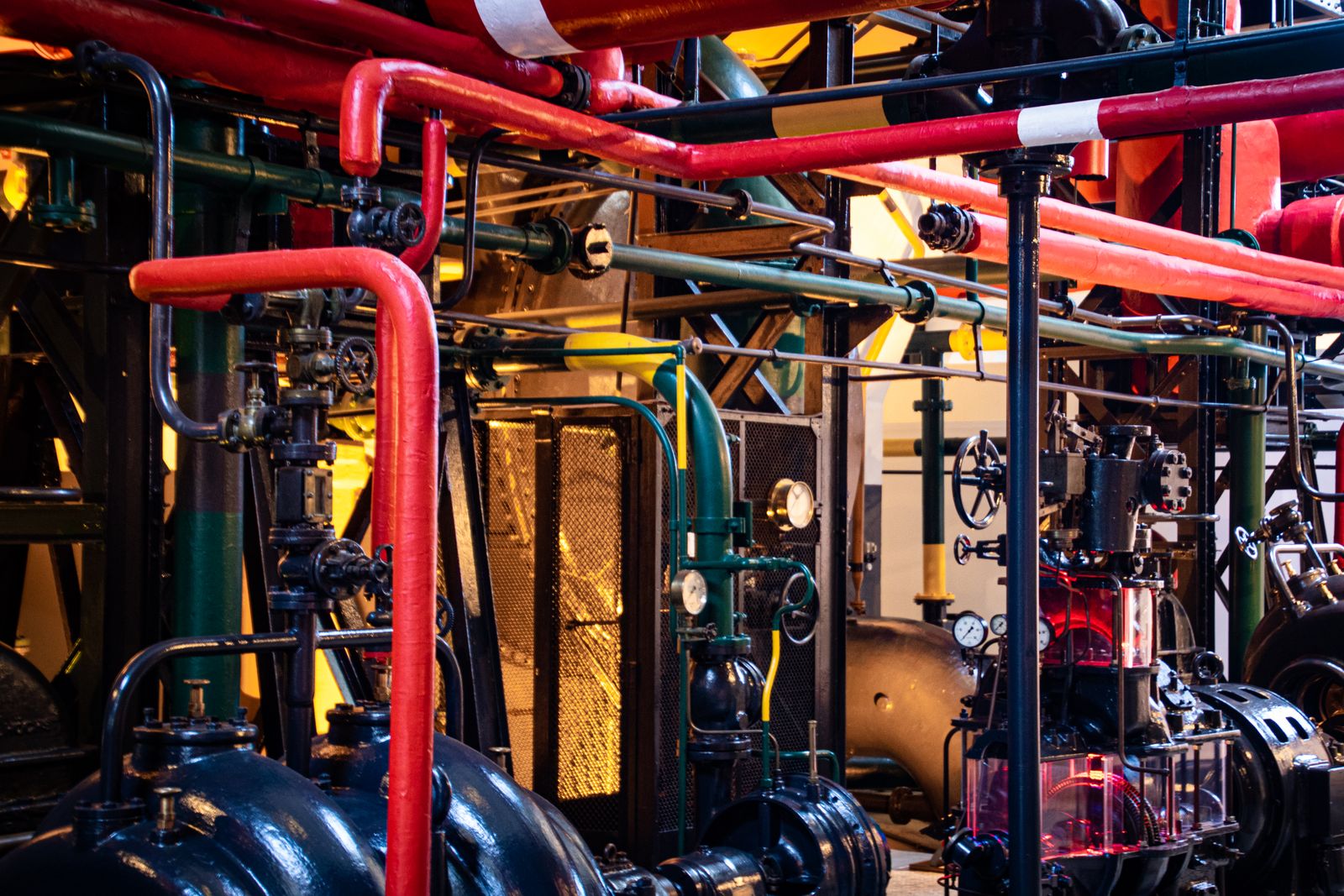 Industrial machinery and piping in a plant machine room