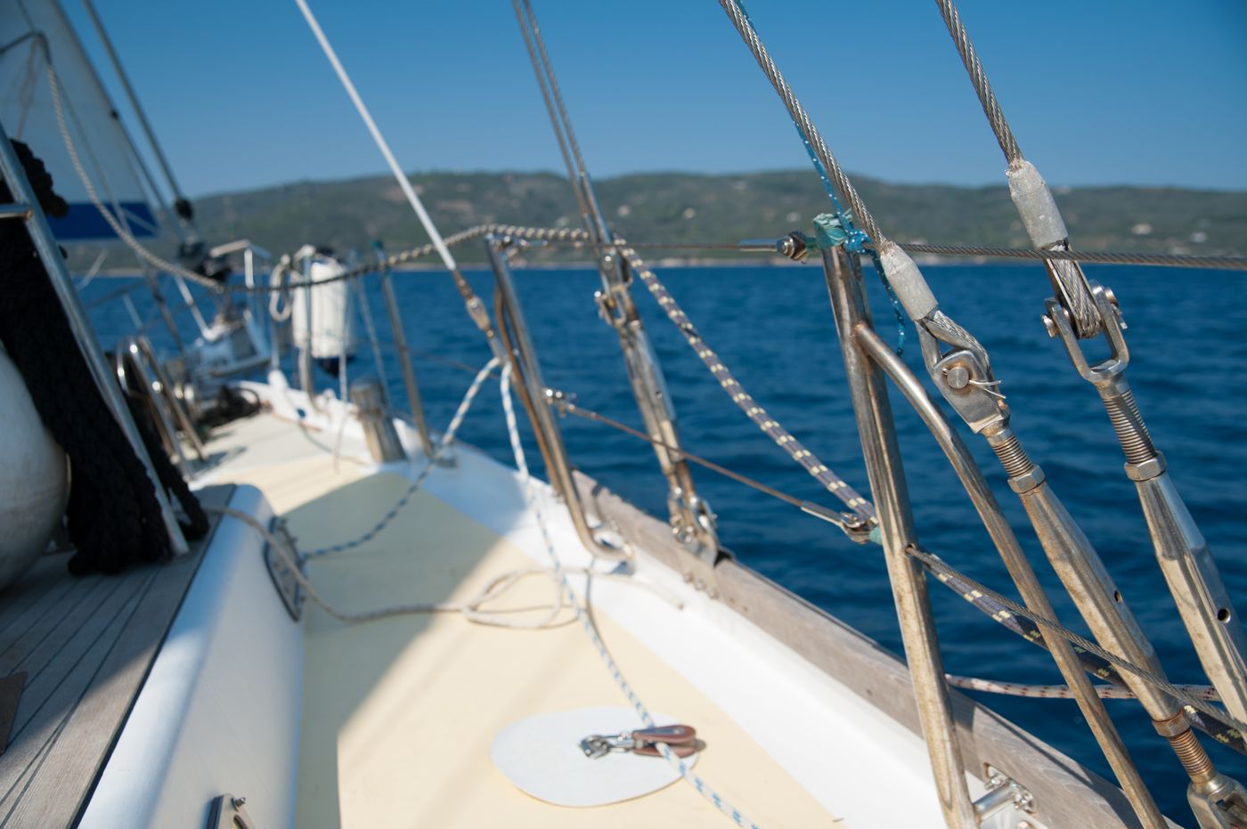 Stainless steel rigging and turnbuckles on a sailboat deck