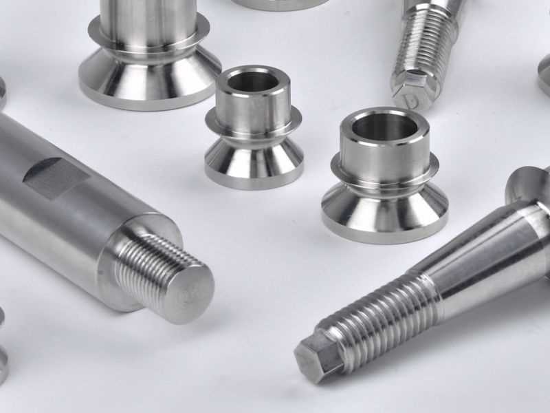 Stainless steel CNC-machined bushings, tri-clamp fittings, and threaded studs